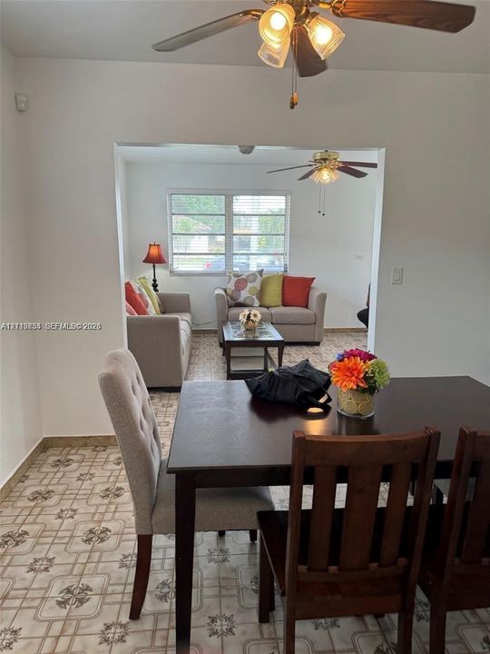 Patterned ceramic tile flooring, multi-pane windows, and dual ceiling fans