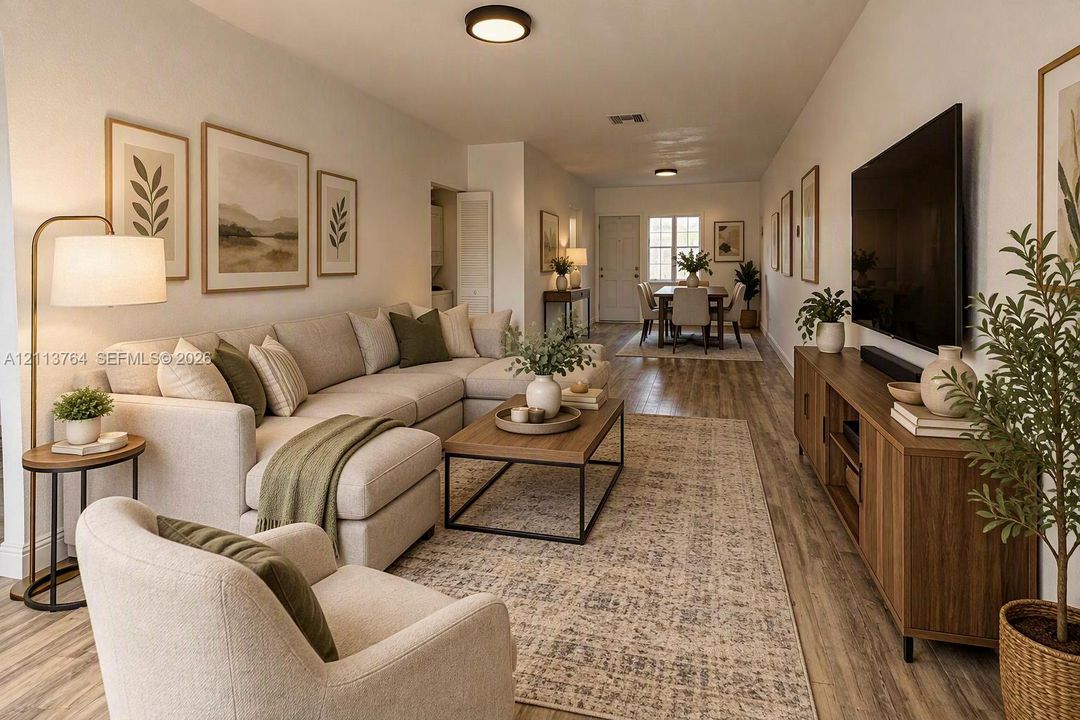 Open-concept interior featuring wood-finish flooring, neutral wall tones, and recessed lighting