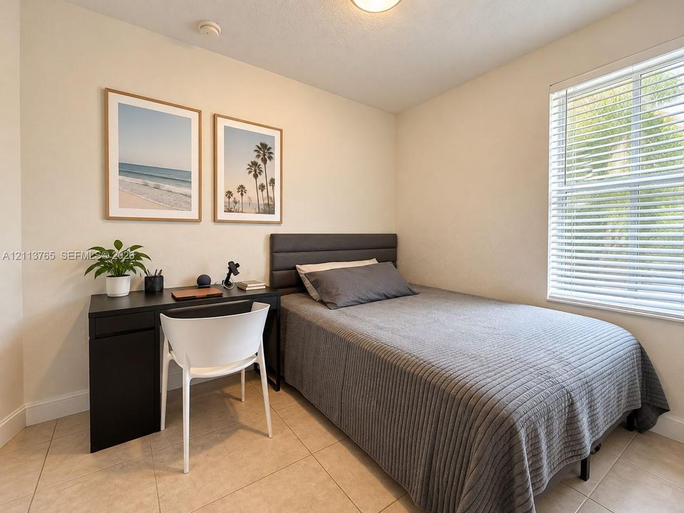 Room featuring neutral wall paint, tile flooring, and a window fitted with horizontal blinds