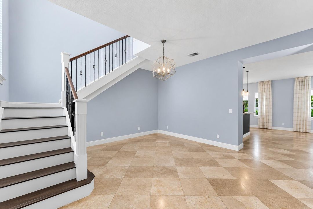 Airy Modern Foyer with Geometric Chandel