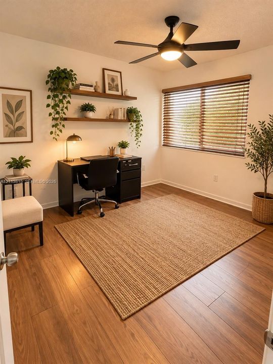 Wood-finish flooring, matte black ceiling fan with integrated lighting, dual wall-mounted floating wood shelves, and horizontal window blinds