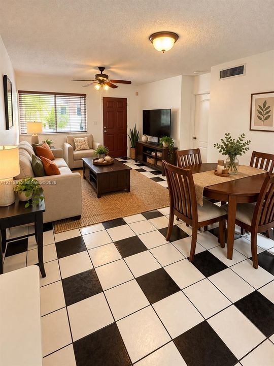 Checkerboard tile flooring, ceiling fan with integrated lighting, flush-mount ceiling fixture, and horizontal blind window treatments