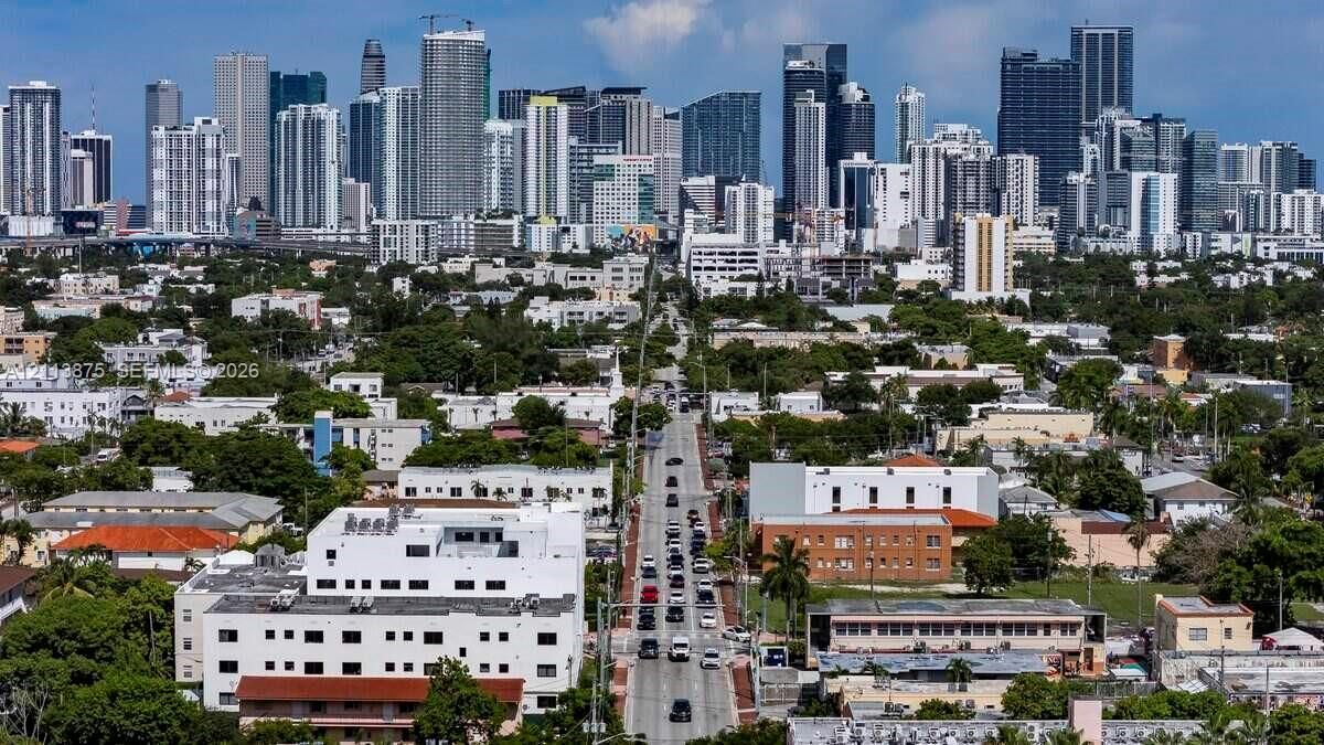 Aerial perspective showcasing an expansive urban skyline featuring high-rise architecture and dense city infrastructure