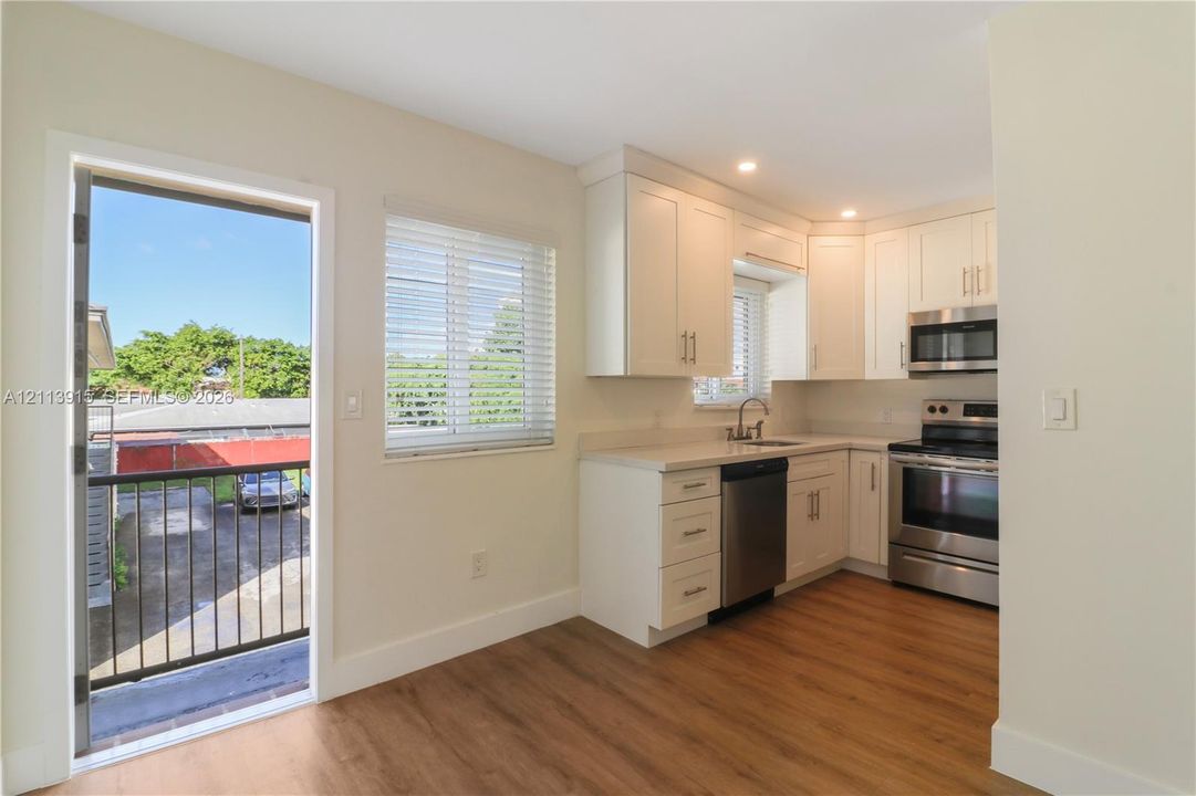 Kitchen & Staircase to Assigned Parking