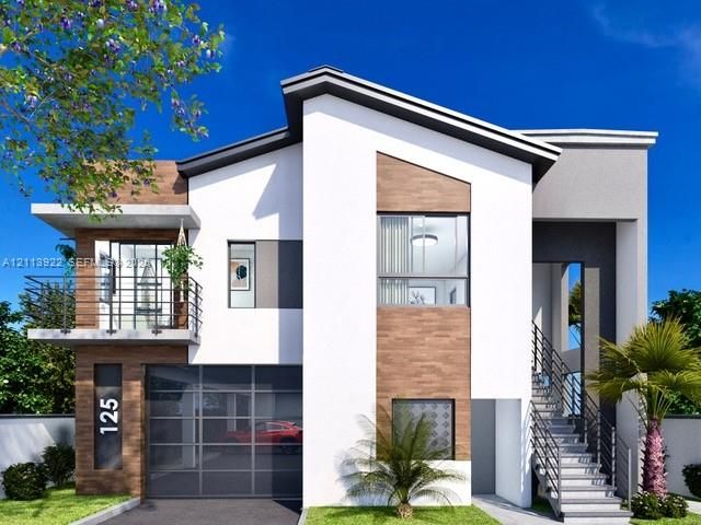 Modern architectural exterior featuring wood-finish paneling, white stucco facade, metal railing balcony, glass garage door, and open-air exterior staircase