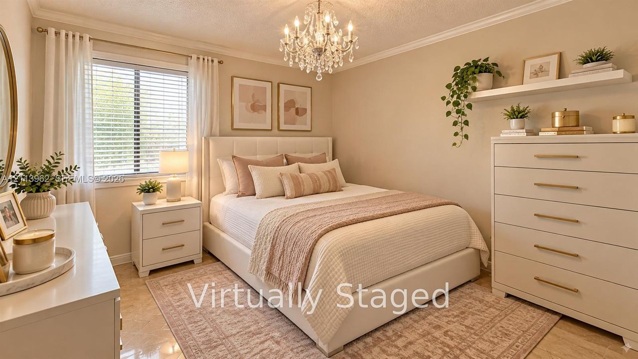 Neutral-toned interior room featuring crown molding, a multi-tiered crystal chandelier, and large-format tile flooring