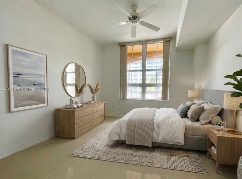 Large grid window, neutral tile flooring, and ceiling fan with integrated lighting