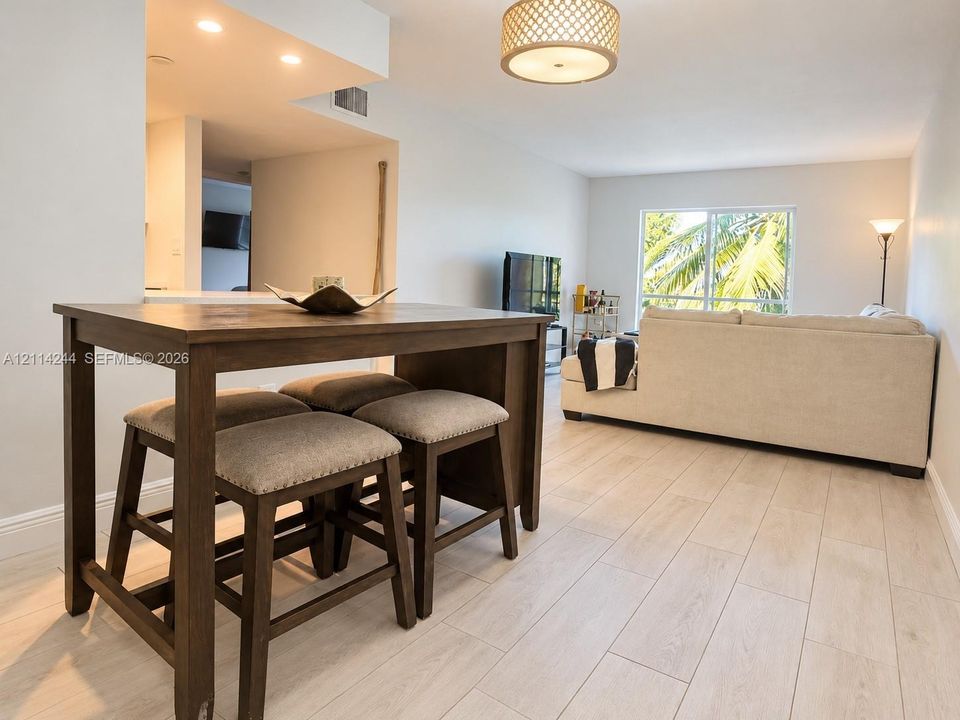 Wood-finish tile flooring throughout.