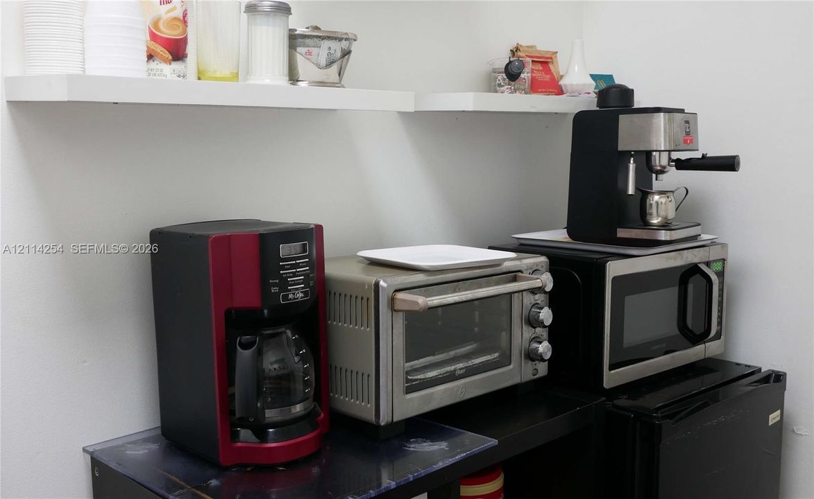Wall-mounted white shelving