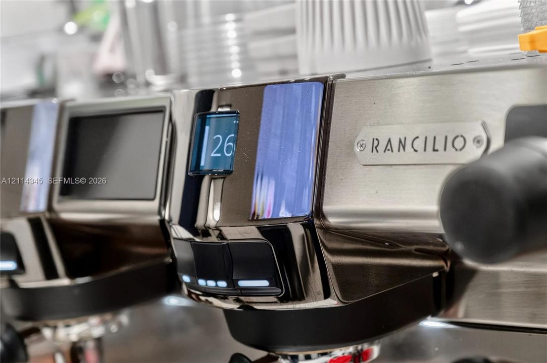 Professional espresso machine featuring a stainless steel chassis