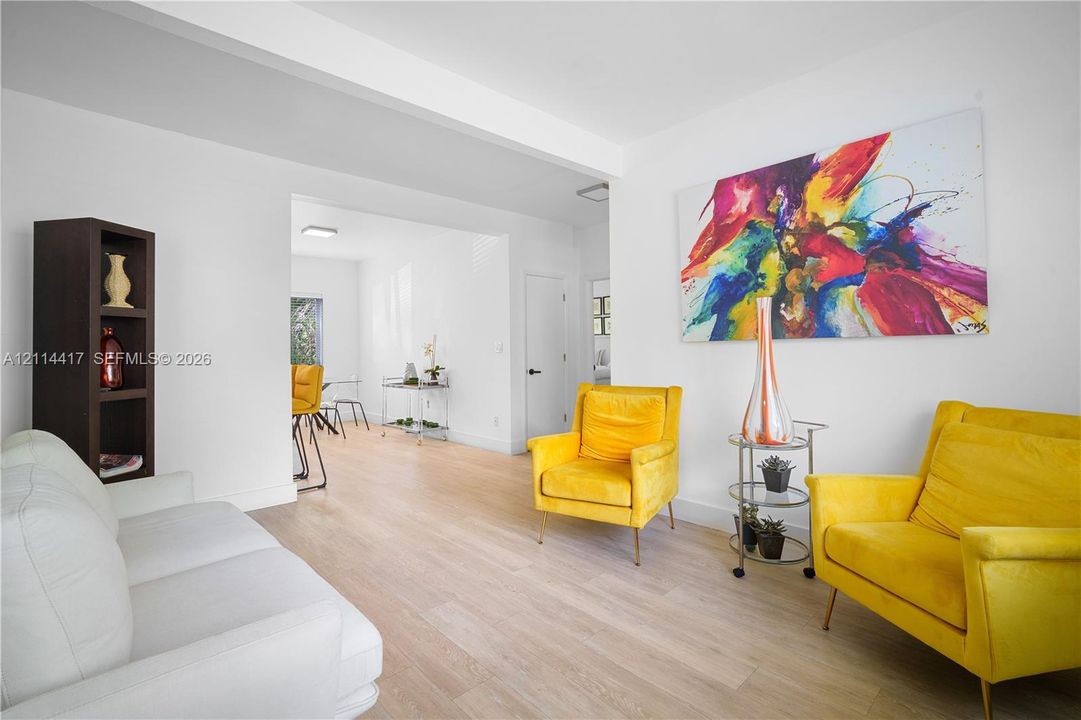 Interior space featuring light-toned wood-finish flooring, built-in shelving, and neutral wall finishes