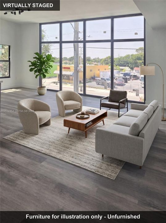 Floor-to-ceiling windows with black framing, wood-finish flooring, and recessed ceiling lighting