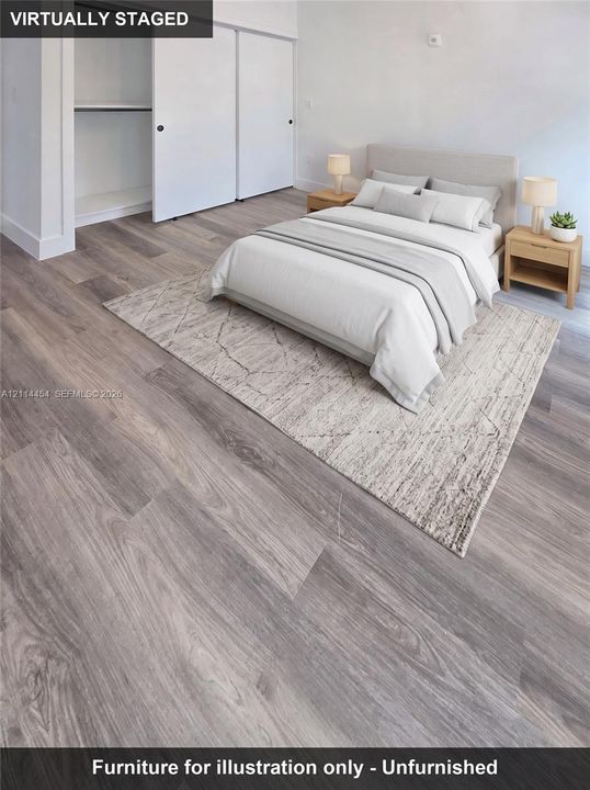 Neutral-toned wood-finish flooring and sliding-door closet with shelving