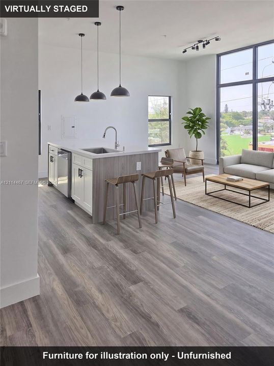 Kitchen featuring wood-finish flooring, a quartz-topped island with under-mount sink, three dome pendant lights, and floor-to-ceiling windows