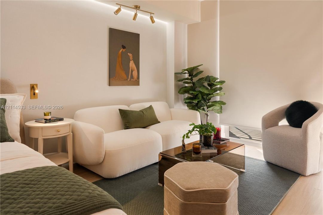 Interior space featuring recessed lighting, multi-directional track lighting, and roller shade window treatments