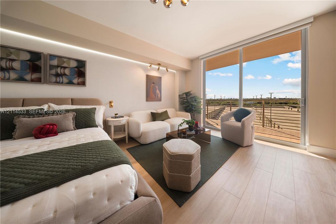 Wood-finish flooring, full-wall sliding glass door, recessed cove lighting, and private balcony