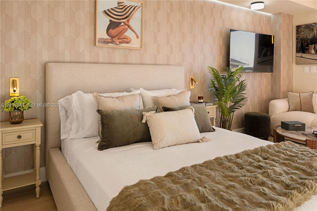 Textured geometric wallpaper, wall-mounted metallic accent lighting, and ceiling-integrated recessed lighting