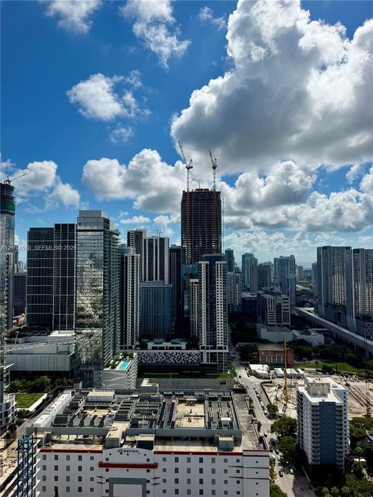 High-rise urban landscape featuring expansive floor-to-ceiling glass architecture and structured metropolitan density