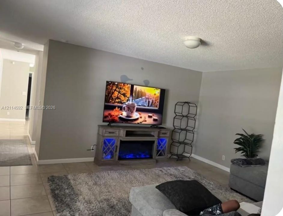 Neutral-toned walls and neutral-colored tile flooring