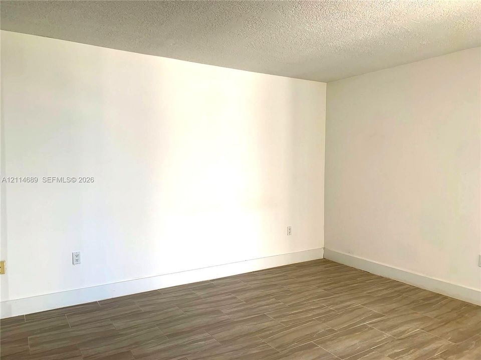 Neutral-toned interior space ceramic tile  flooring and smooth-textured walls