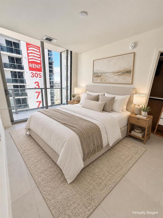 Floor-to-ceiling glass wall, private balcony with metal railing, and neutral tile flooring