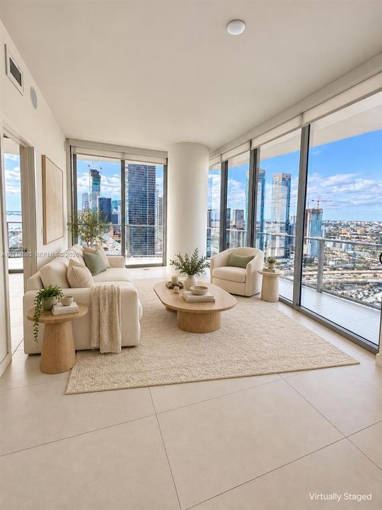Floor-to-ceiling glass windows, expansive panoramic skyline scenery, large-format tile flooring, and a private balcony with metal railing