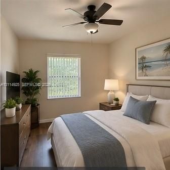 Neutral-toned walls, wood-finish flooring, and a ceiling fan with integrated lighting