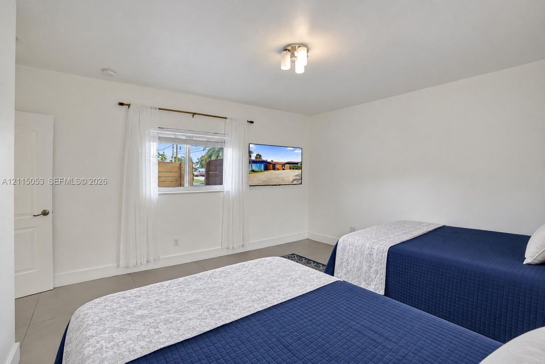 Bedroom 2 – Spacious and versatile, as a media room, entertainment lounge, or game room.