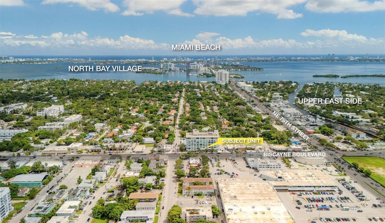 Aerial perspective of property located on Biscayne Boulevard, featuring proximity to major thoroughfares, dense tree canopy, coastal proximity, and surrounding urban infrastructure
