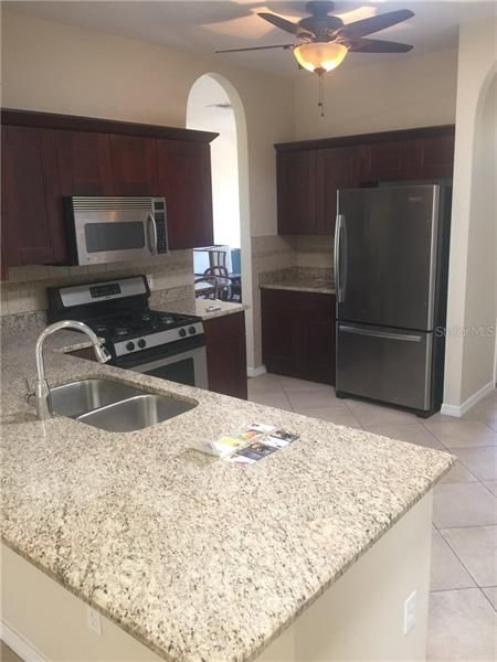 Brand new granite countertop and kitchen cabinets. Stainless steel appliances.