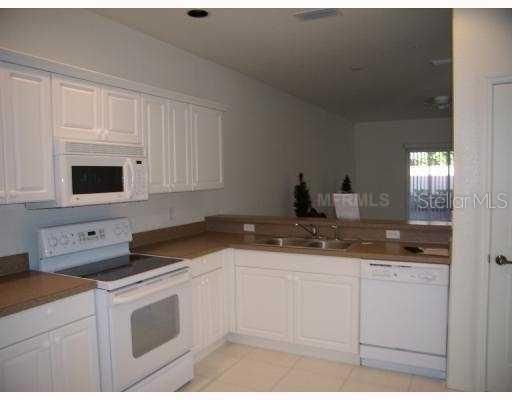 Kitchen - WITH VIEW OF LIVING ROOM AND VIEW ON LANAI