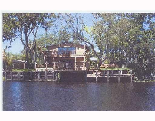 Exterior Front - Located on the Braden River, a short boat ride to Linger Lodge resort, gorgeous sunsets are free!