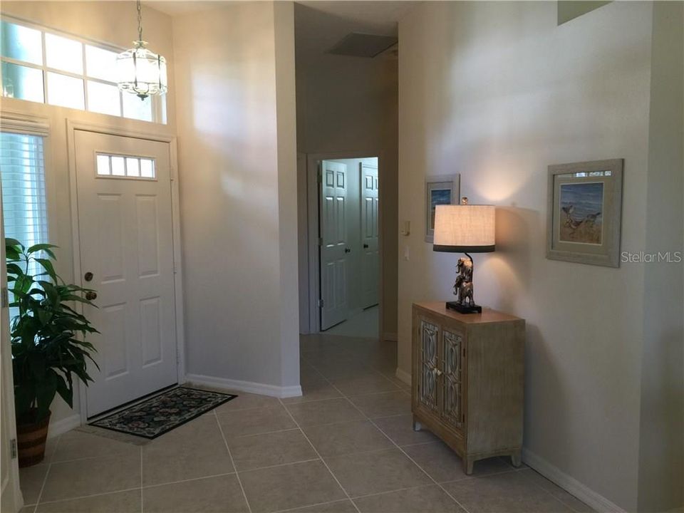 Front entrance shows off the split floor plan.  Through the corridor is the two guests rooms & guest bath.....