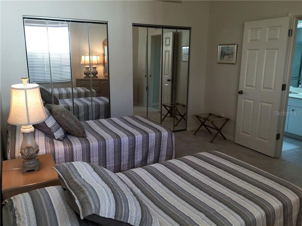 Wonderfully decorated for guests, these two twin beds welcome guests.  This room even has double closets!