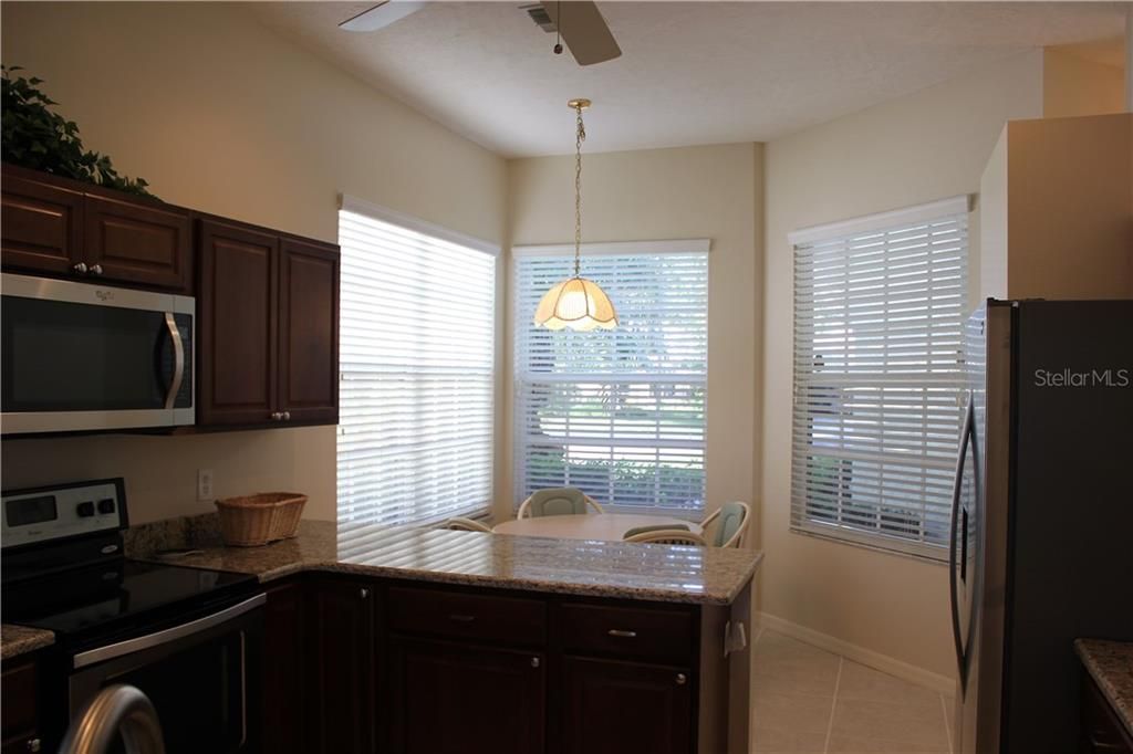 Breakfast nook in kitchen area, as well as a breakfast bar!