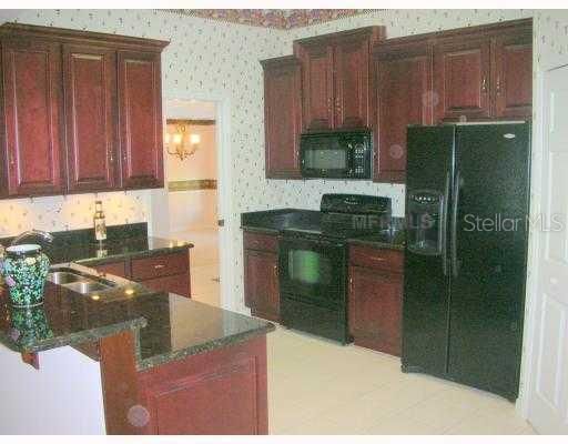 Kitchen - Cherry Cabinets and Granite countertops.....wow.