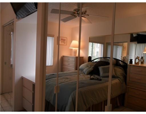 Bedroom 1 - Mirrored bifold doors in bedroom hide clothes closet and laundry closet with washer and dryer hook up.