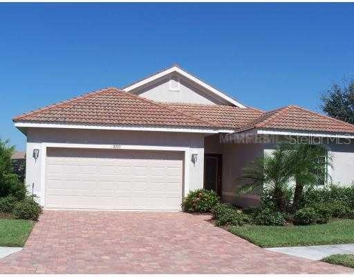 Exterior Front - FRONT VIEW OF 4 BEDROOM HOME WITH POOL AND SCREENED LANAI IN GATED GOLF COURSE COMMUNITY OF HERITAGE HARBOUR
