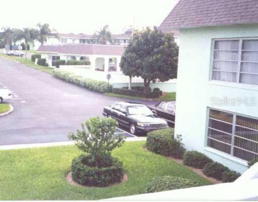 Exterior Front - View from 2nd floor entry of #811, pool and laundry area in center.