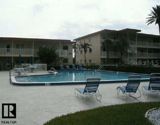 Exterior Front - Large pool to relax in.