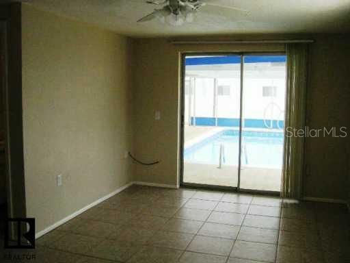 Other - LOVELY TILED FAMILY ROOM LEADING RIGHT OUT TO THE LARGE SWIMMING POOL