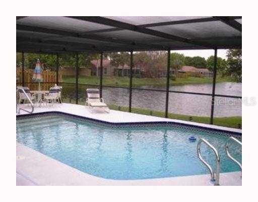 Exterior Front - Backyard, Pool and Lake