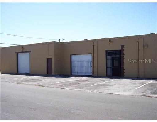 Exterior Front - Front Entrance with 2 Bay Doors, and Side entrance Door.