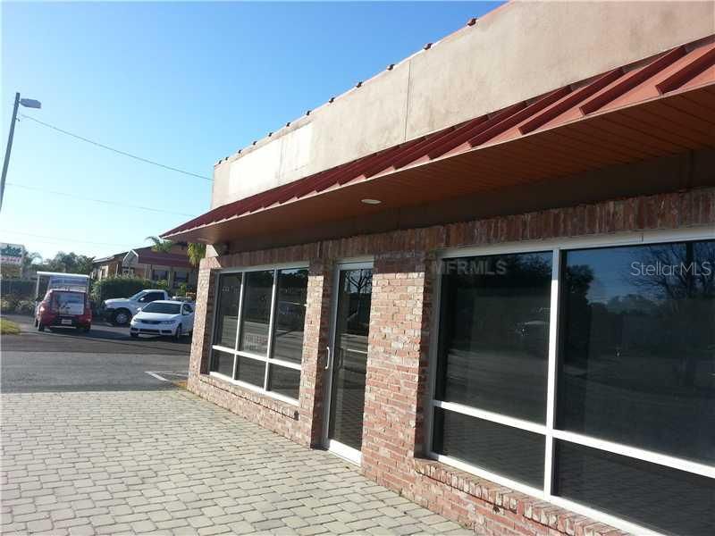 Exterior Front - The aestically pleasing brick front and paver entry offer a professional welcome to your clients. With more than enough parking and excellent visibility of property which abuts West Columbus Drive, this space will not last long.