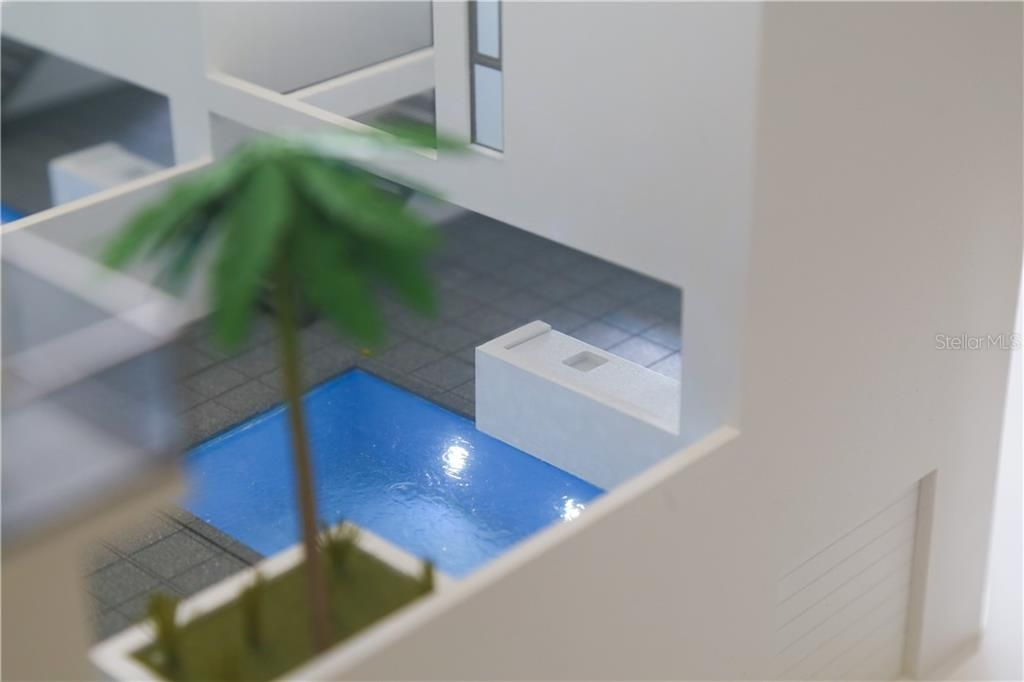 Close up view of private terrace in residence with pool.