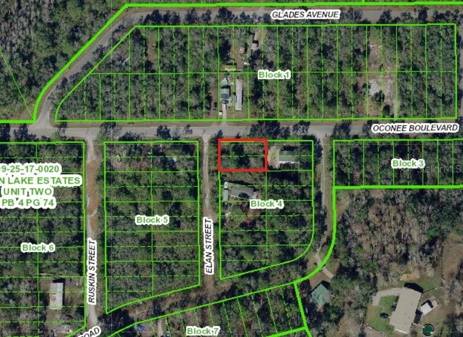 Large corner lot on PAVED road.