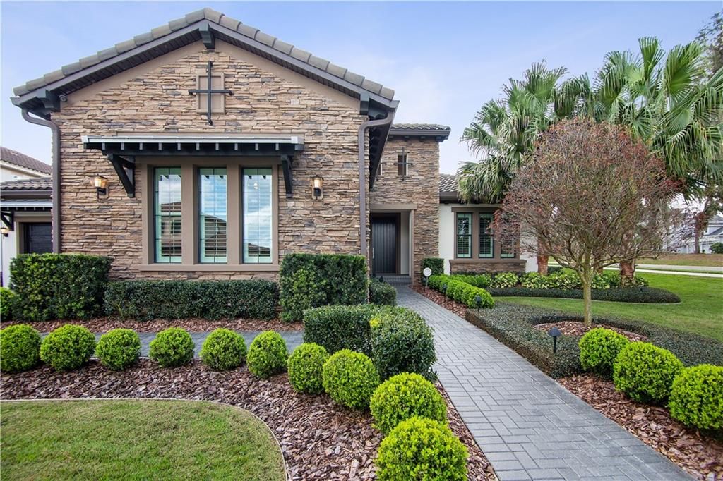 Luxury meets functionality in this custom built Cardel Wilshire executive home in the coveted village of FishHawk Preserve!