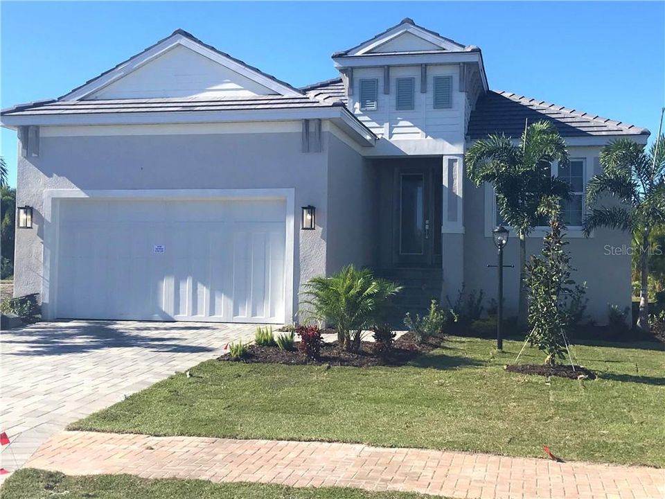 Medallion Home's St Thomas in Legends Bay. Beautiful Coastal elevation and Peaceful Preserve views