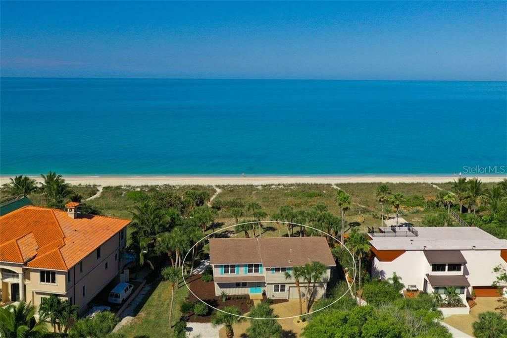 Imagine your dream home here.  Enjoy the old beach house until you start to build new.
