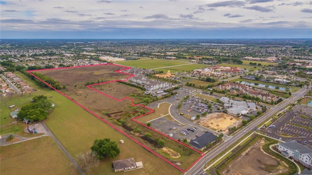 Arial view: The parcel sits north of The Villages  Buffalo Ridge, commercial corridor.